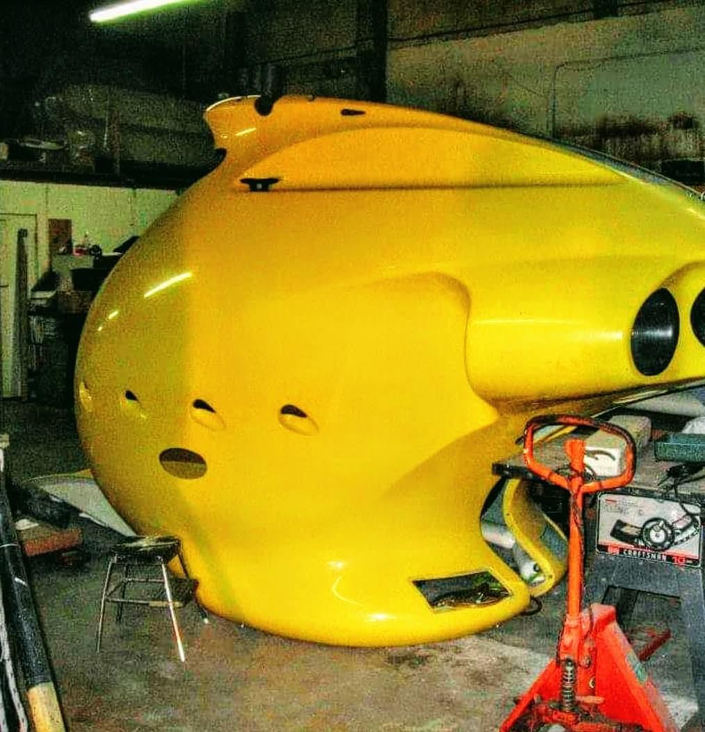 SM300-3 Plinio Seniore — yellow hull, acrylic viewport, and keel in the shop